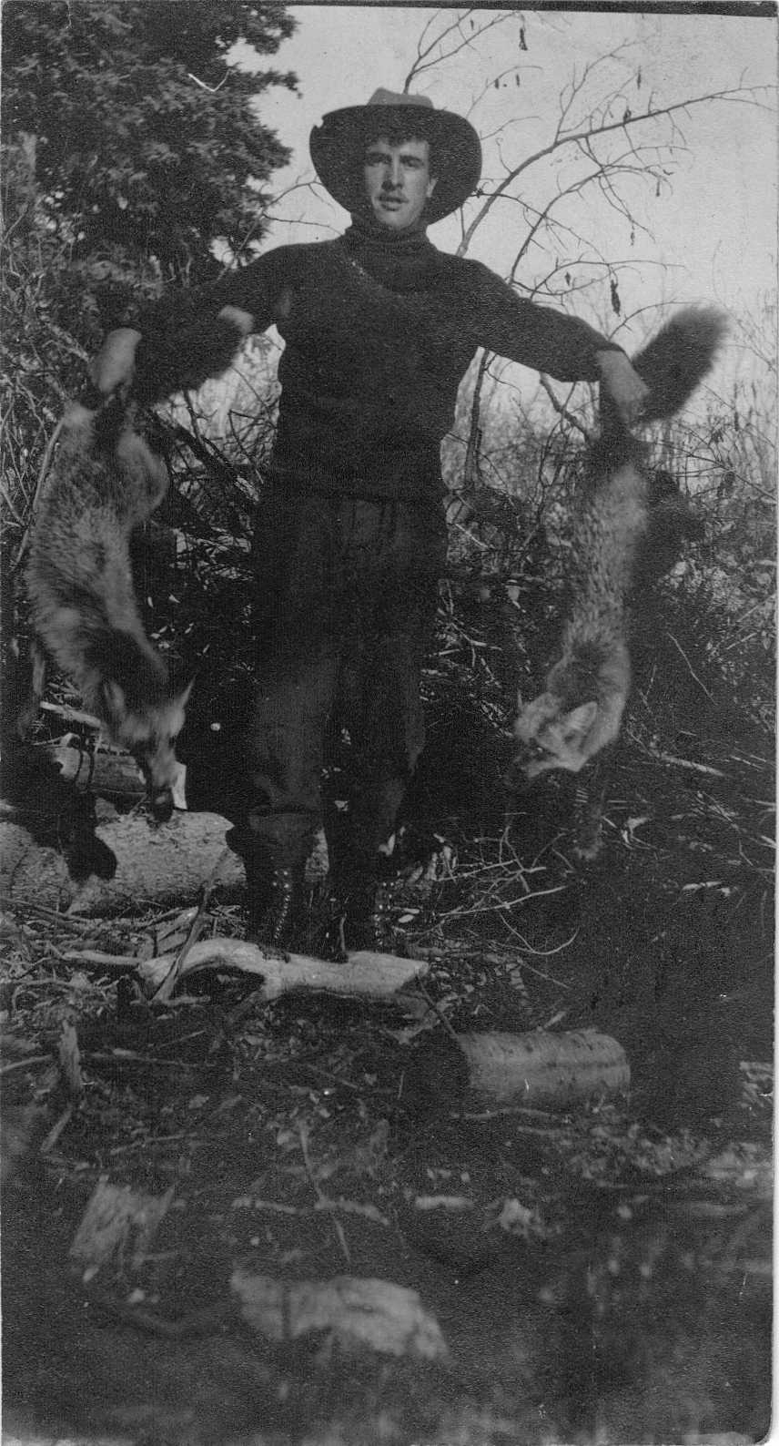 Photo of Aimé Brooks holding results of Fur Trapping Expedition Peace River 